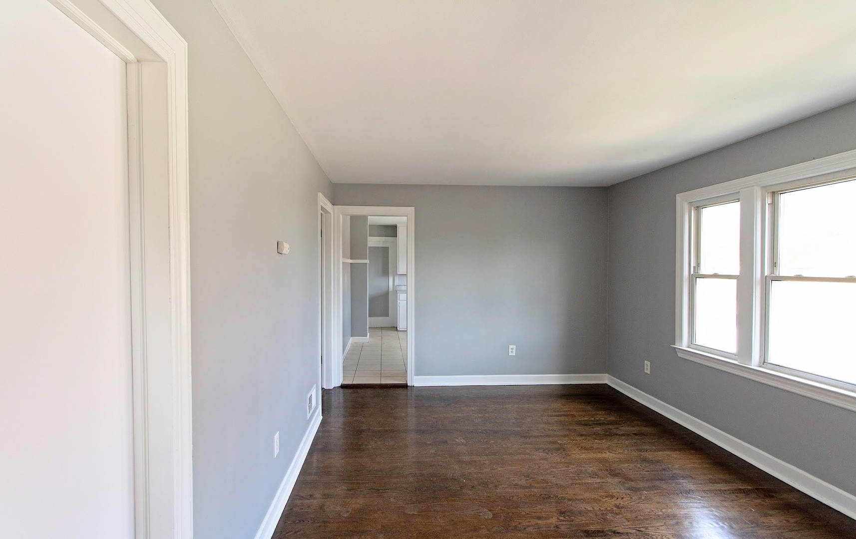 7535 West 58th Place Summit, IL 60501 - Photo 20 of 34 an empty room with wooden floor and windows