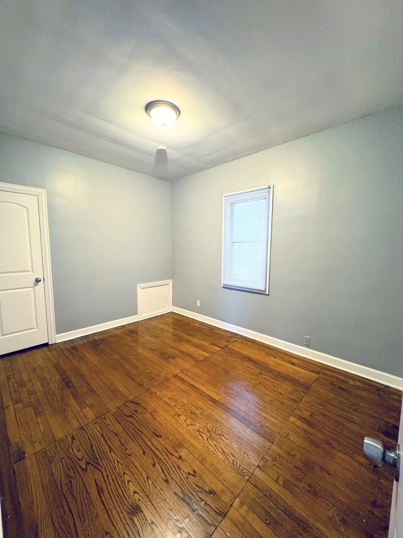 7535 West 58th Place Summit, IL 60501 - Photo 7 of 34 a view of empty room with wooden floor