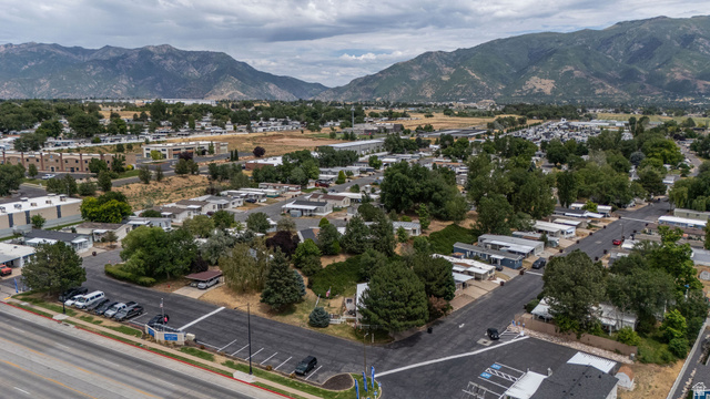 2600 North Hill Field Road, Unit 5 Layton, UT 84041 - Photo 29 of 33 Expansive community featuring mature trees, paved streets, and mountain scenery
