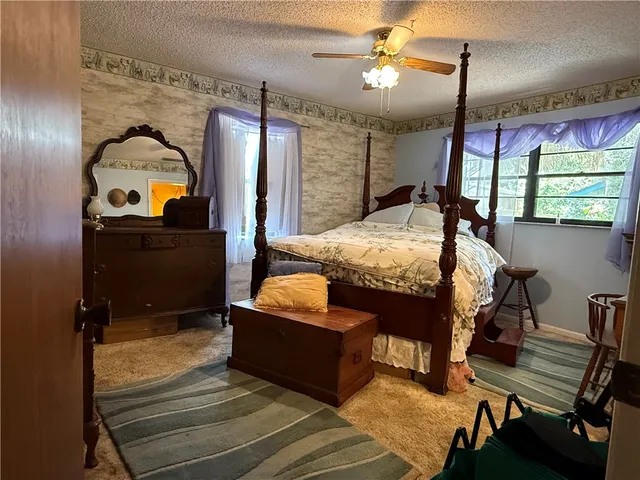 a bed room with a bed and a balcony