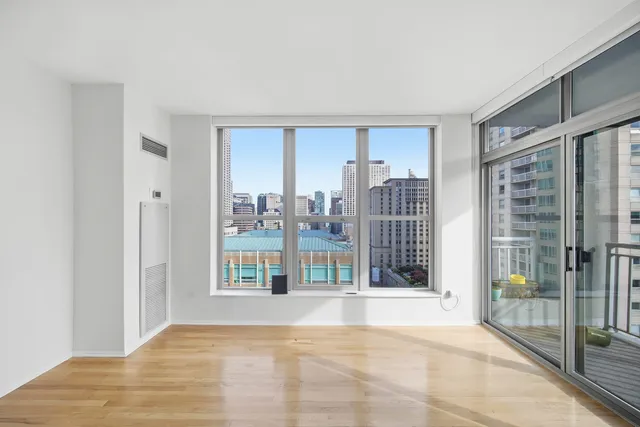 a view of an empty room with glass door