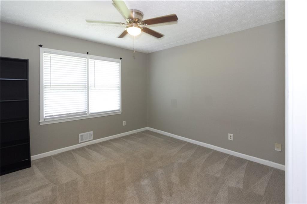 374 McGiboney Road Covington, GA 30016 - Photo 17 of 29 wooden floor in an empty room with a window