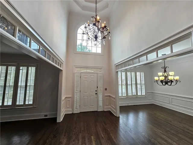 a view of an entryway with wooden floor