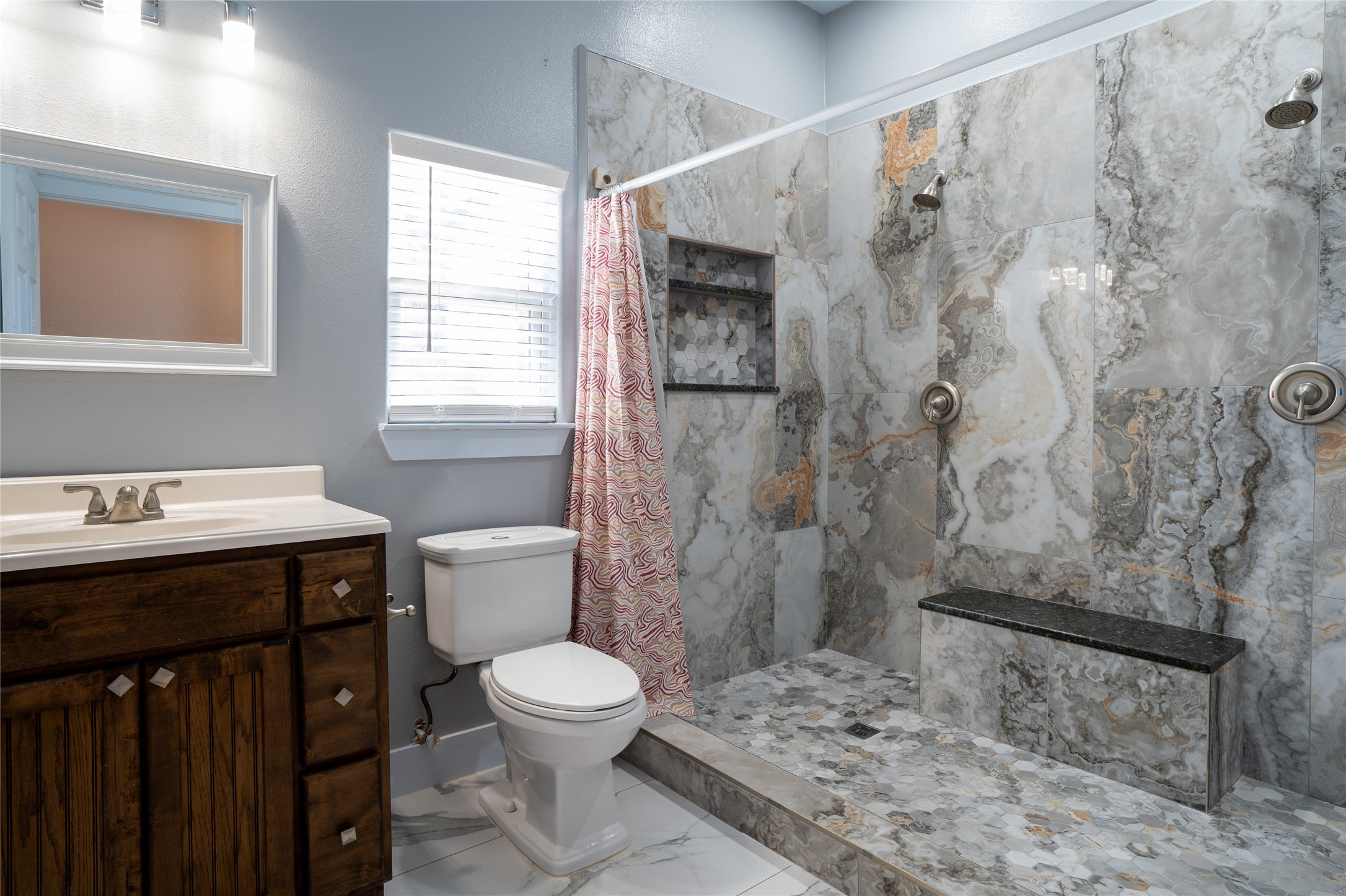 661 Hidden Oak Road Dale, TX 78616 - Photo 13 of 36 a bathroom with a sink a toilet and shower