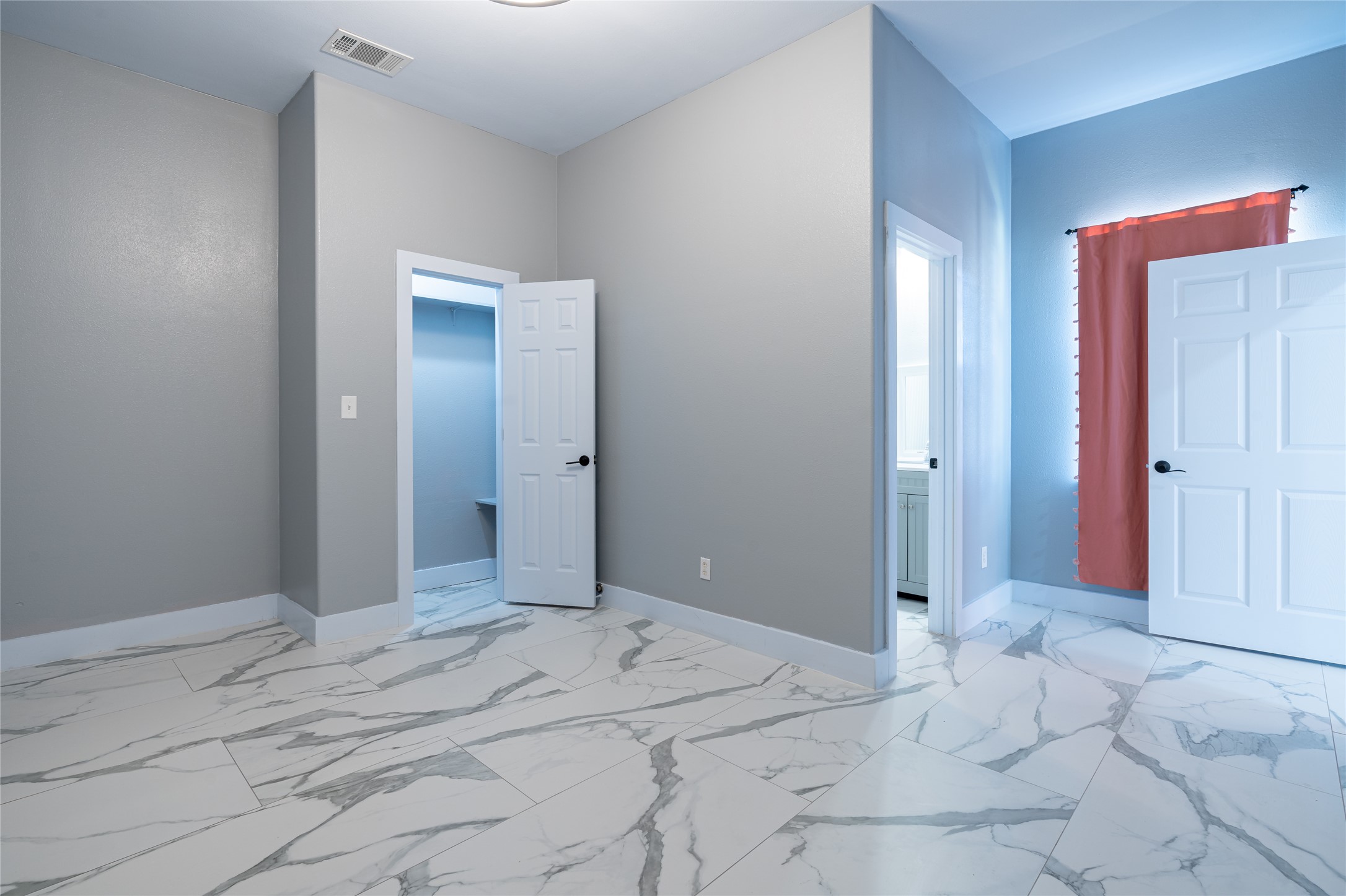 661 Hidden Oak Road Dale, TX 78616 - Photo 19 of 36 a view of a bedroom with wooden floor and bathroom