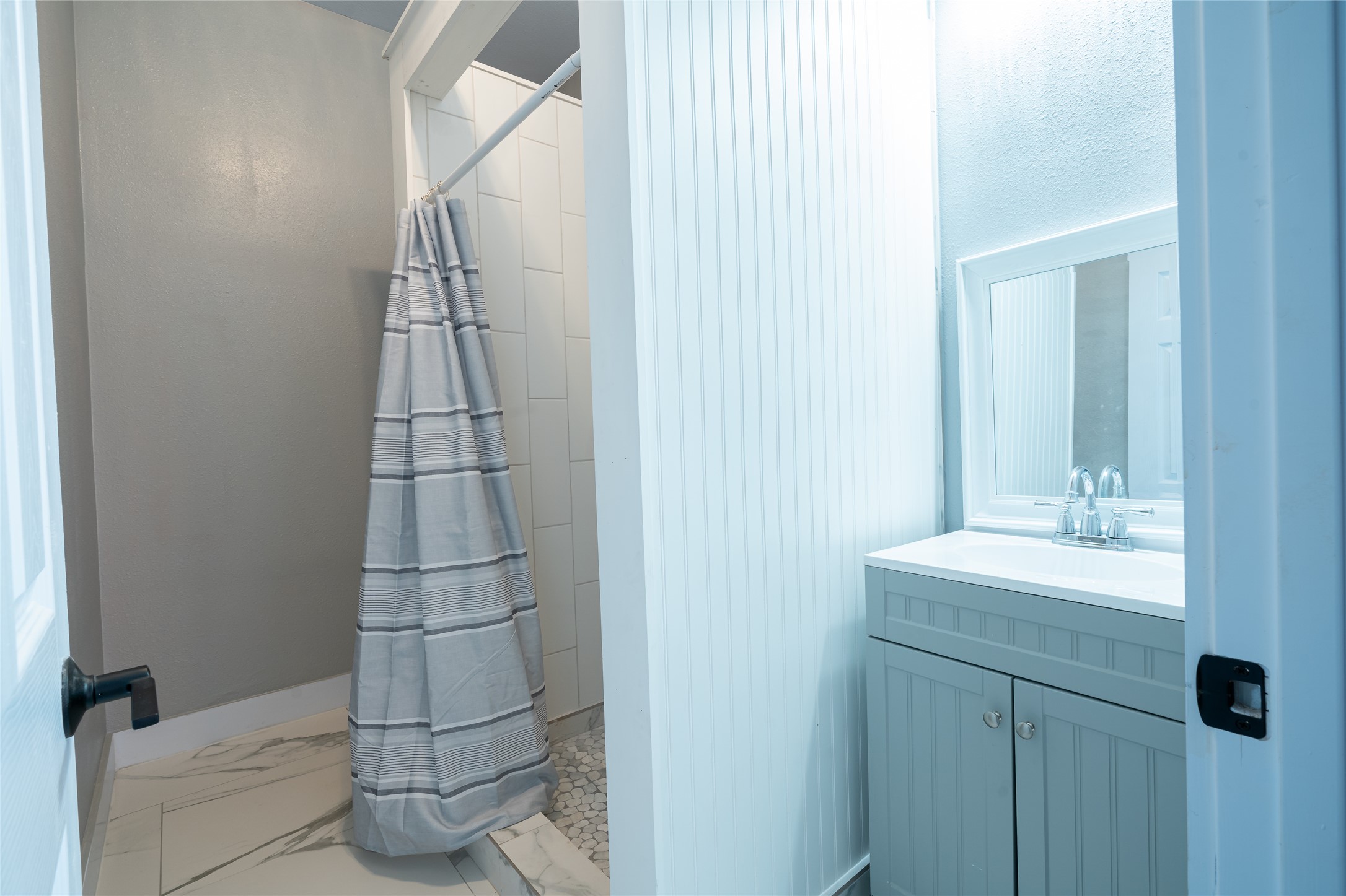 661 Hidden Oak Road Dale, TX 78616 - Photo 20 of 36 a bathroom with a sink and mirror