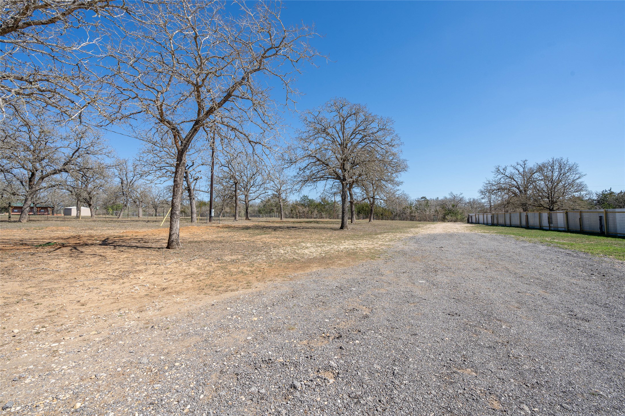 661 Hidden Oak Road Dale, TX 78616 - Photo 3 of 36 a view of dirt field with trees