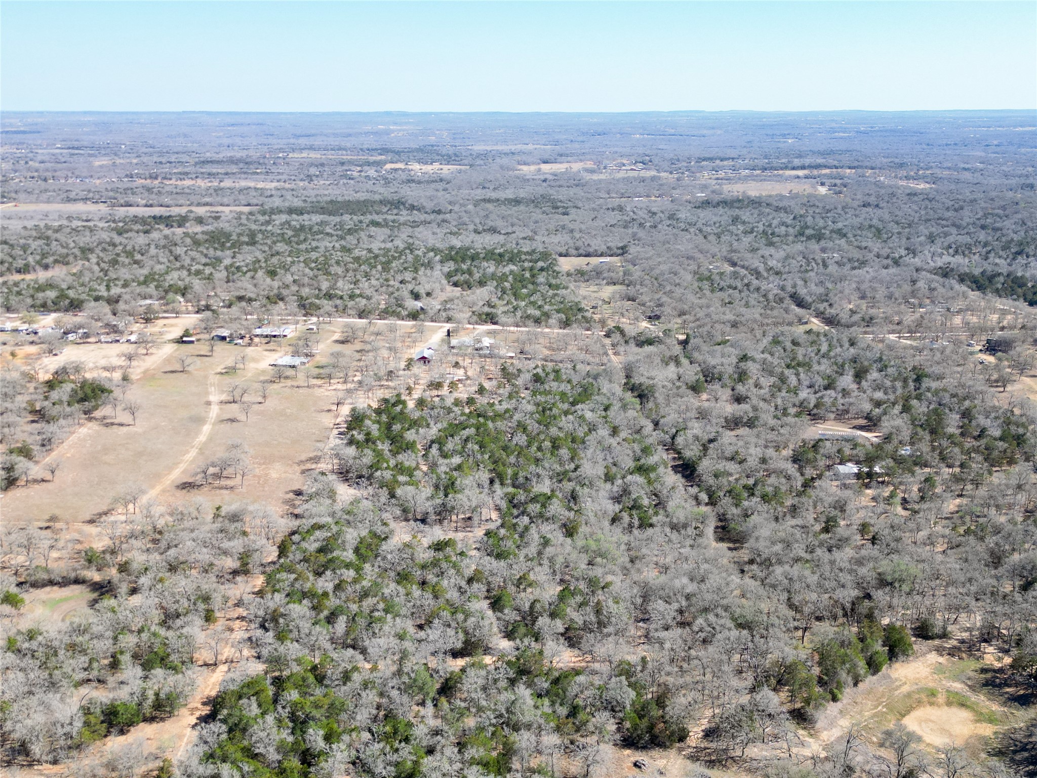 661 Hidden Oak Road Dale, TX 78616 - Photo 36 of 36 an aerial view of house with yard and mountain in the background