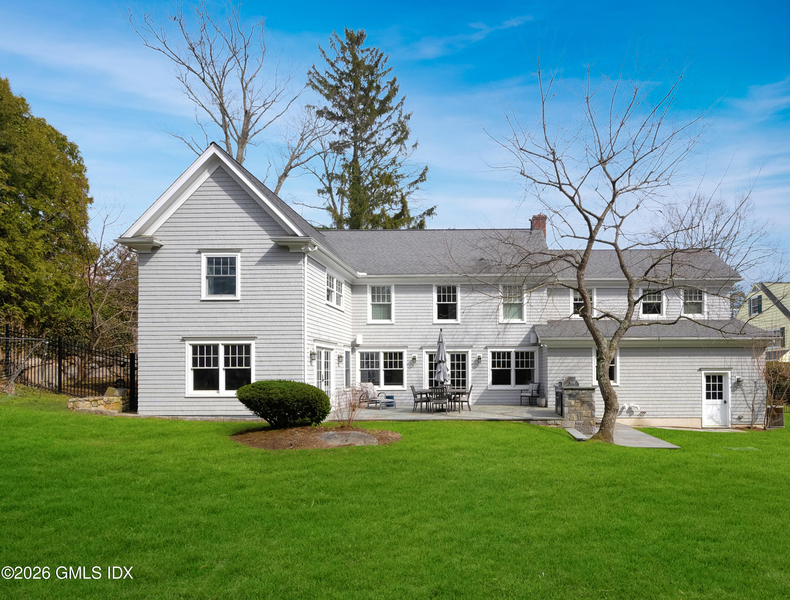 15 Pell Place Riverside, CT 06878 - Photo 30 of 35 a front view of a house with a garden