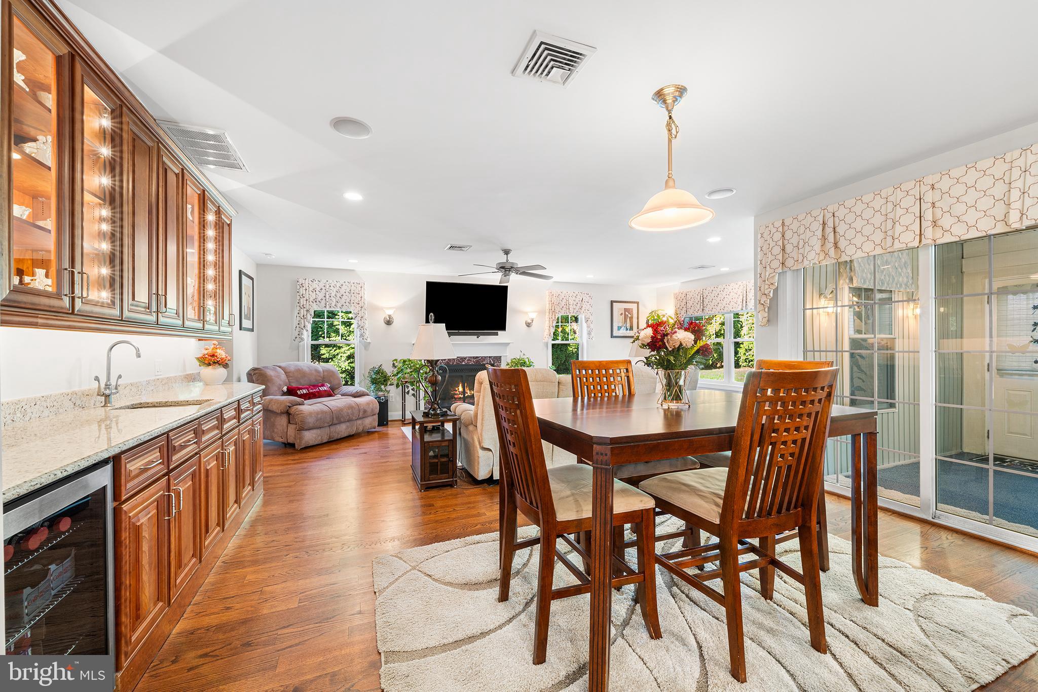 524 Sagamore Road Havertown, PA 19083 - Photo 15 of 43 a view of a dining room and livingroom with furniture wooden floor a chandelier