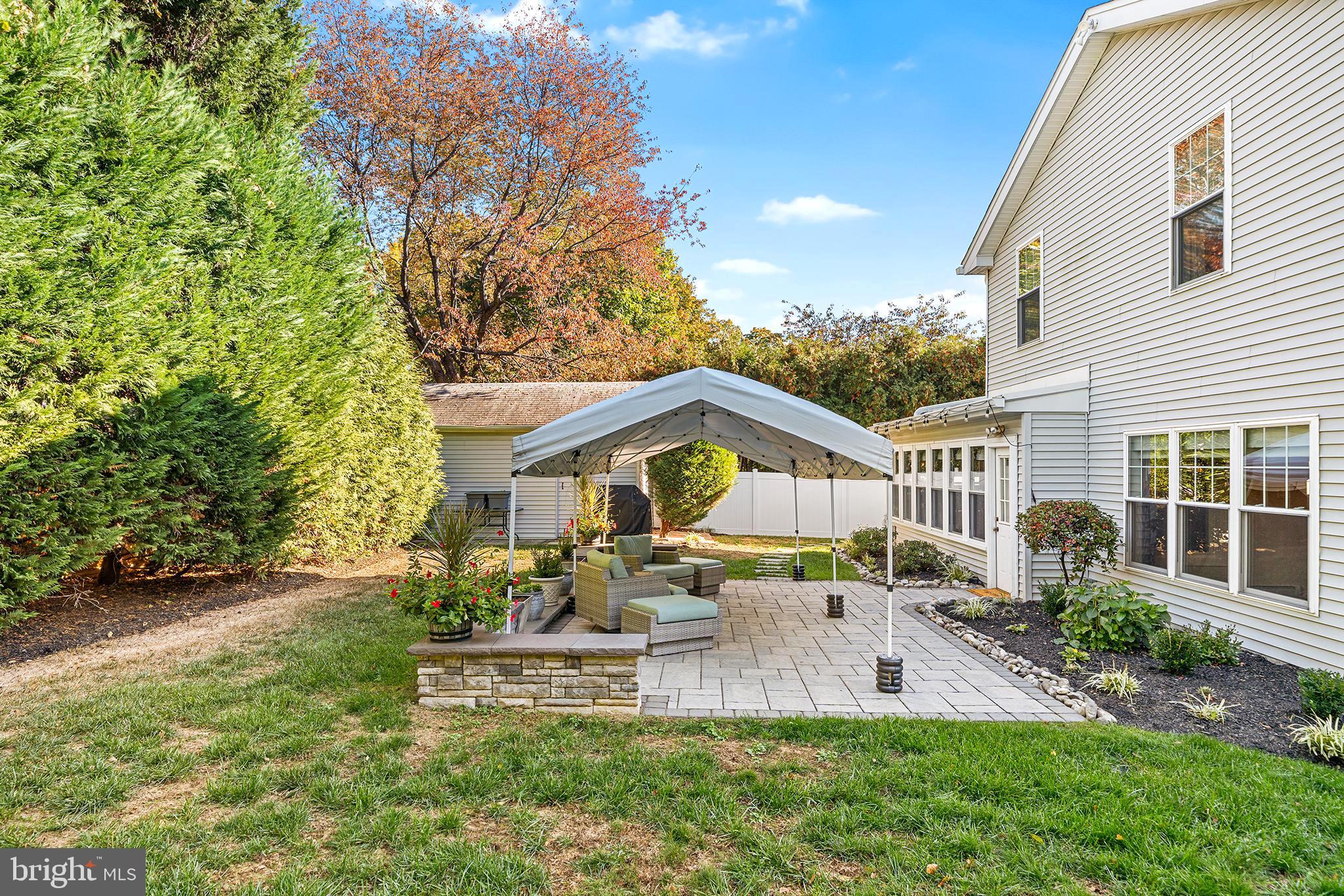 524 Sagamore Road Havertown, PA 19083 - Photo 42 of 43 a front view of a house with a yard table and chairs