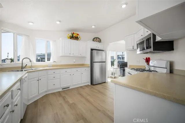 a view of an outdoor space with furniture and umbrella