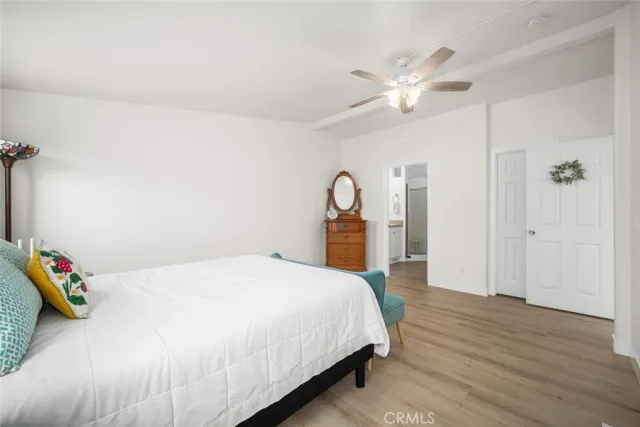 a view of a white house with a swimming pool