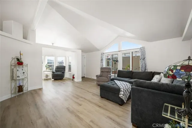 a kitchen with stainless steel appliances white cabinets and white appliances