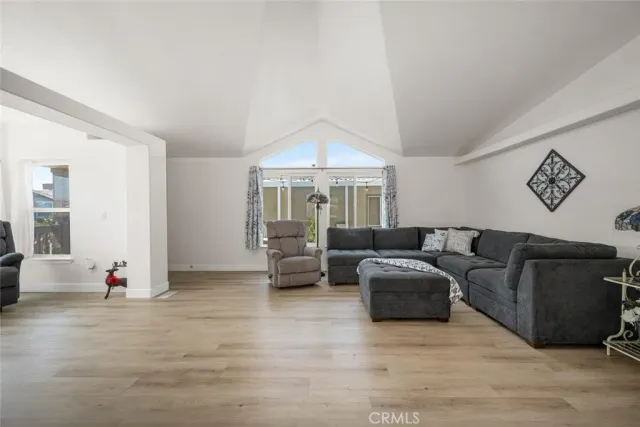 a kitchen with stainless steel appliances white cabinets and white appliances