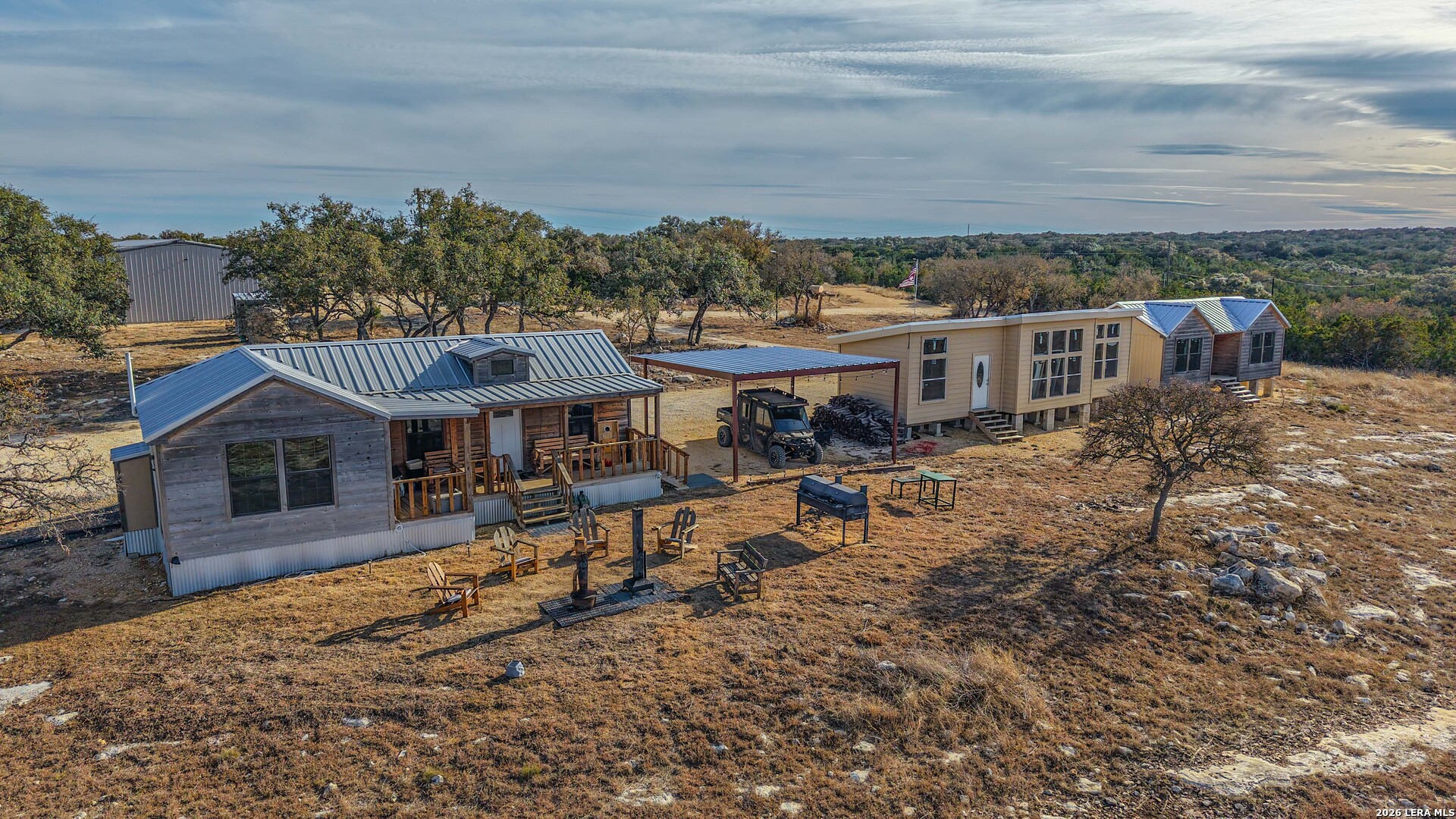 15019 County Road 310 Rocksprings, TX 78880 - Photo 14 of 90 an aerial view of a house with a yard table and chairs