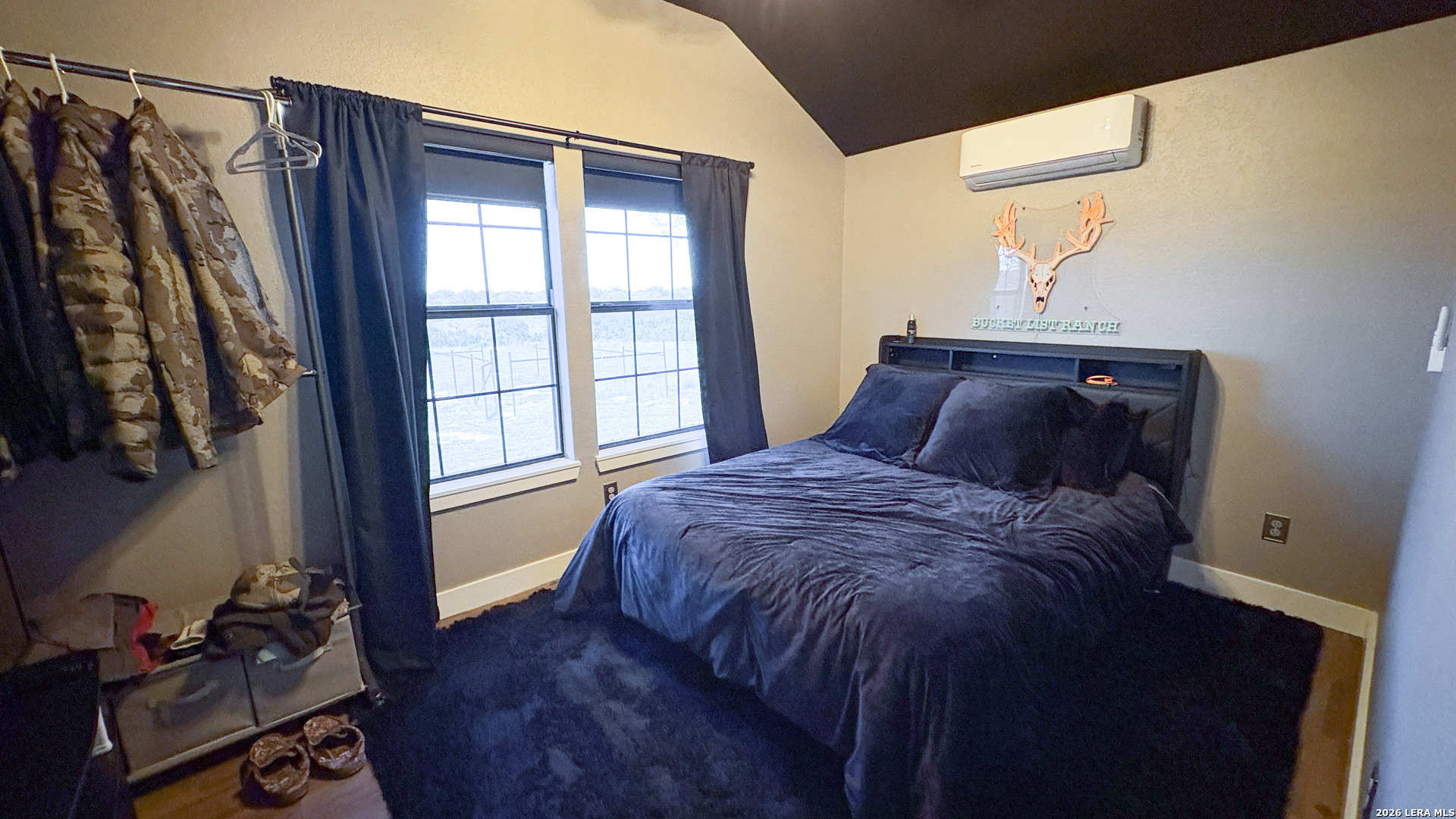 15019 County Road 310 Rocksprings, TX 78880 - Photo 25 of 90 a bedroom with a bed and a window