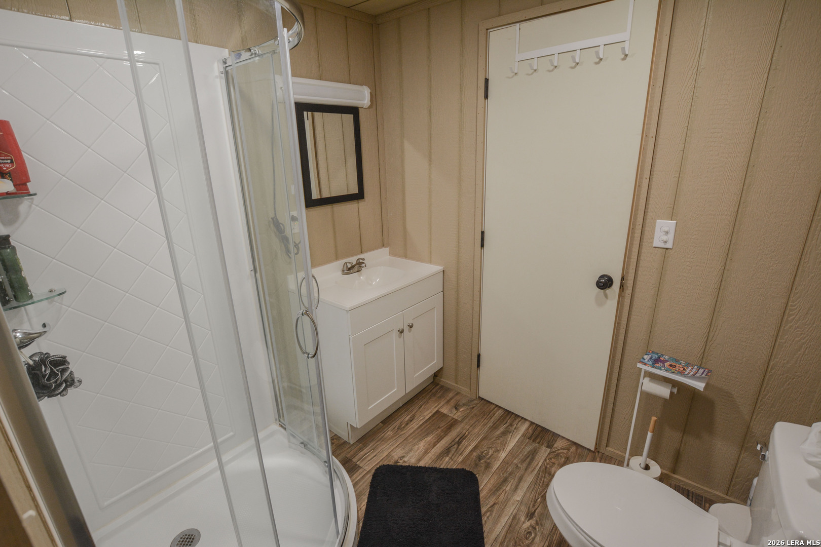 15019 County Road 310 Rocksprings, TX 78880 - Photo 34 of 90 a bathroom with a sink a toilet a mirror and vanity