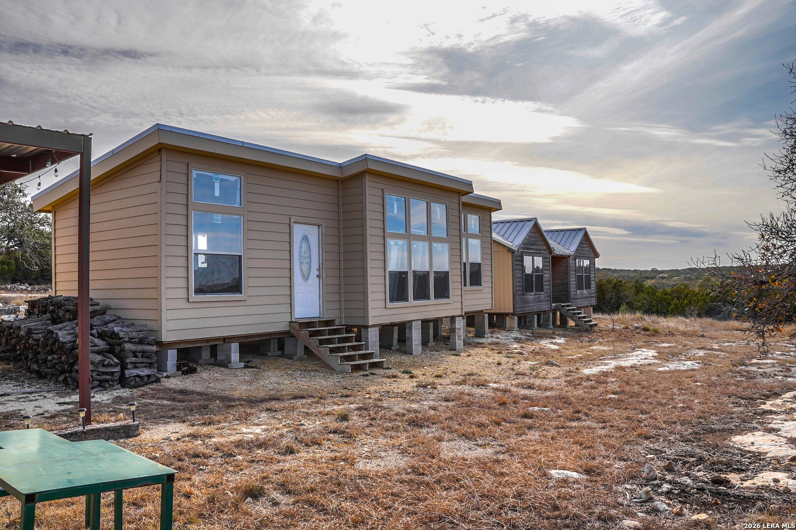 15019 County Road 310 Rocksprings, TX 78880 - Photo 37 of 90 a backyard of a house with table and chairs
