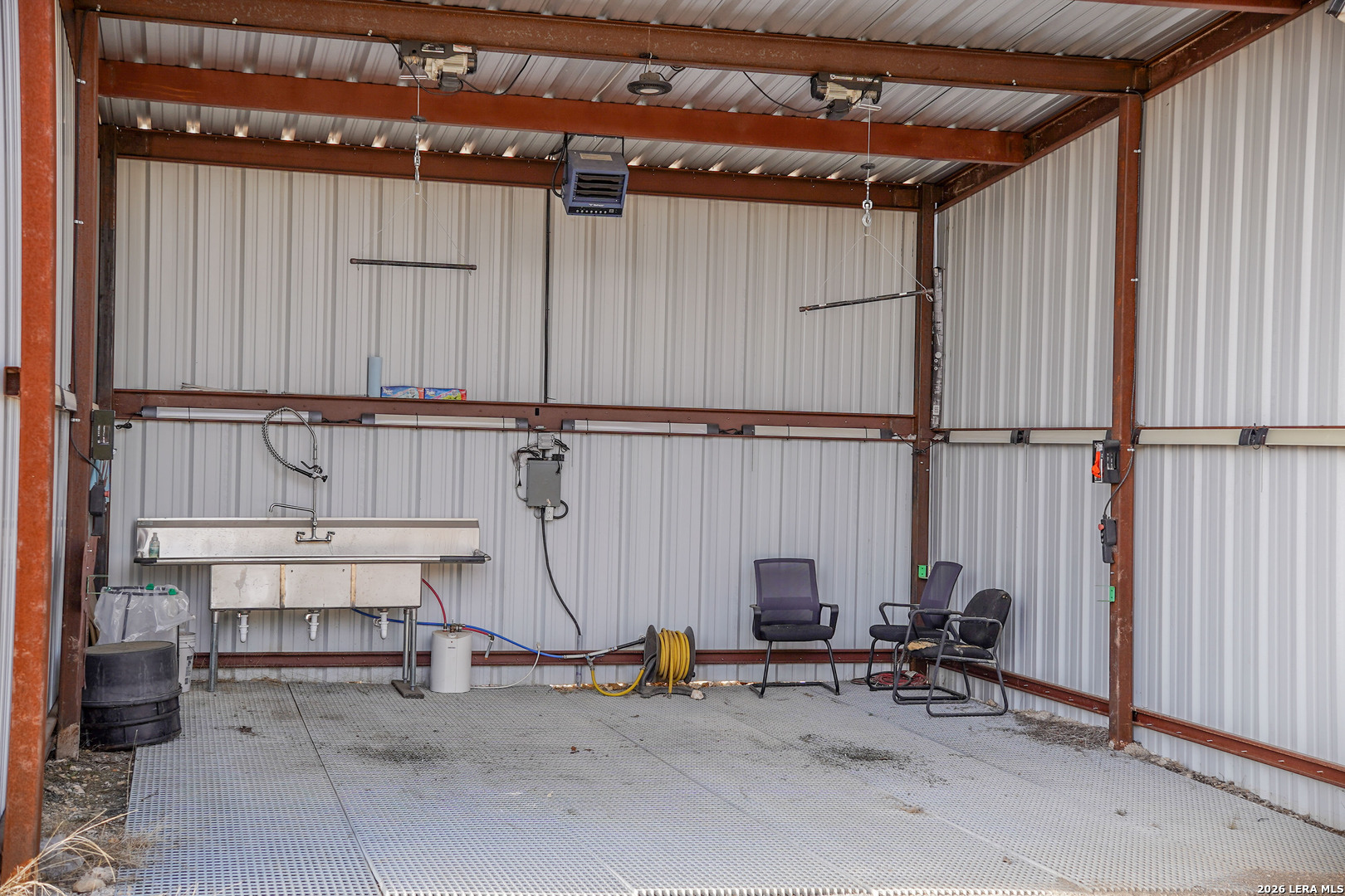 15019 County Road 310 Rocksprings, TX 78880 - Photo 41 of 90 a view of storage and utility room with racks on the wall