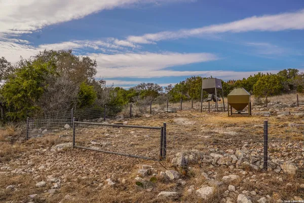a aerial view of a house with a yard and sitting space