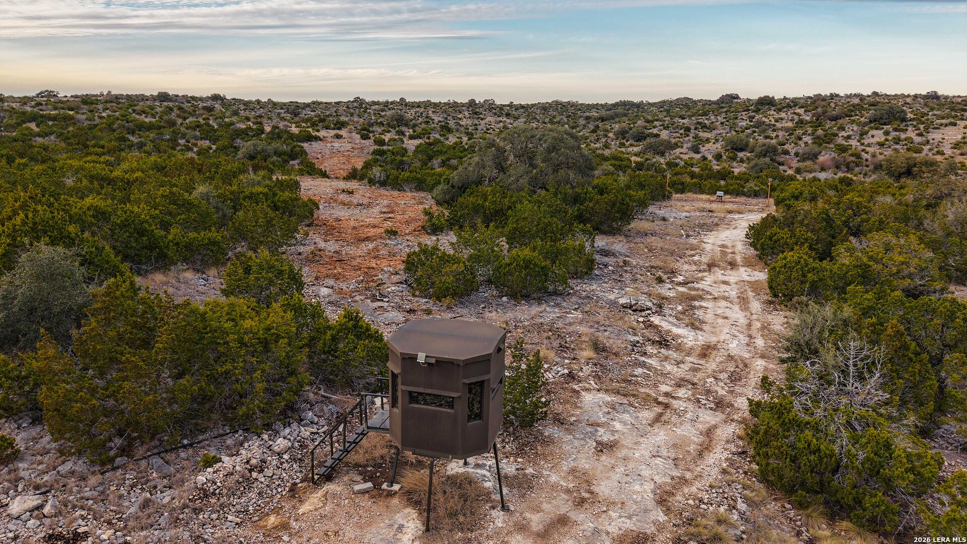15019 County Road 310 Rocksprings, TX 78880 - Photo 59 of 90 a view of a city with lawn chairs and iron fence