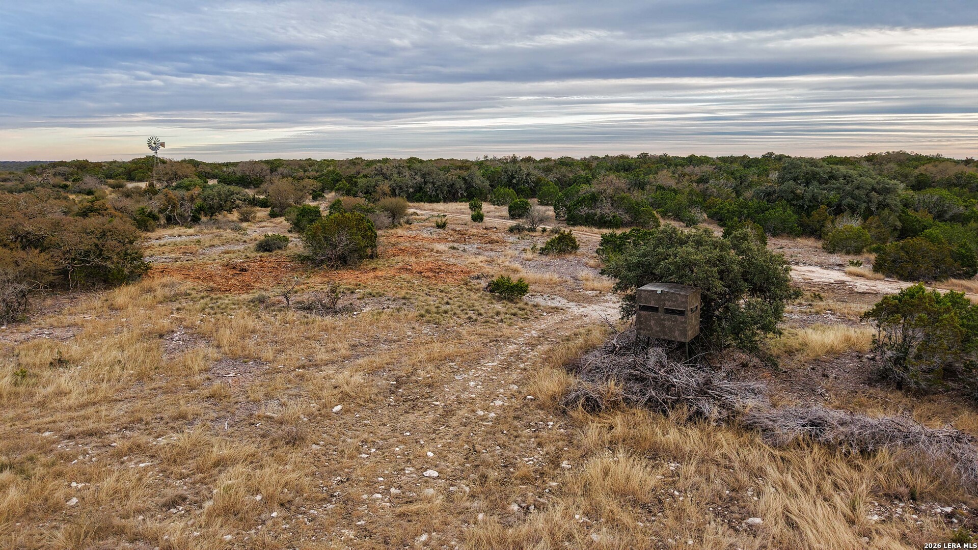 15019 County Road 310 Rocksprings, TX 78880 - Photo 64 of 90 a view of a lake with a mountain in the back