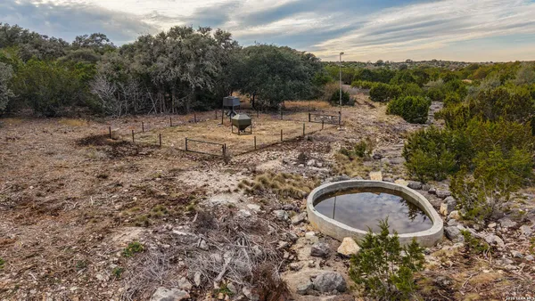 a view of a balcony with chairs and wooden floor
