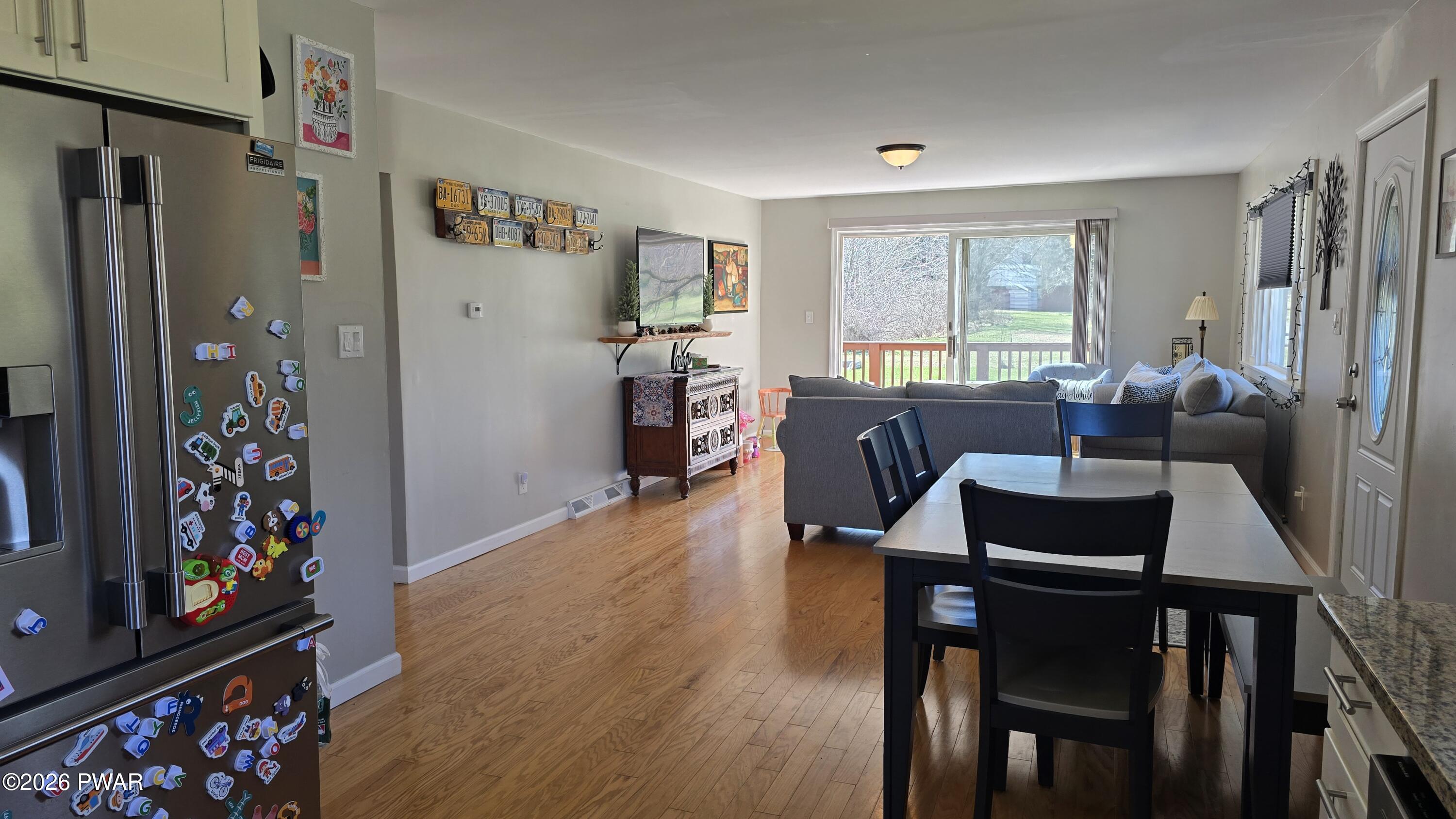 430 Griffith Road Tyler Hill, PA 18469 - Photo 8 of 31 a view of a dining room with furniture and a flat screen tv