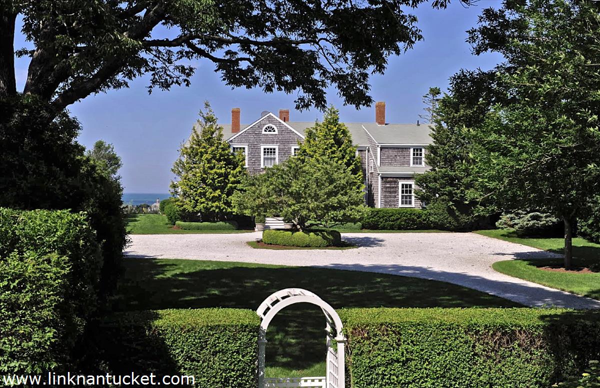47 Cliff Road Nantucket, MA 02554 - Photo 5 of 22 a view of a garden with plants and large trees