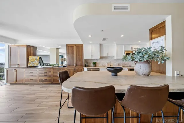 a kitchen with a table and chairs