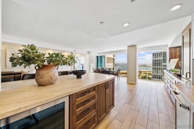 a kitchen with stainless steel appliances granite countertop a sink and stove top oven