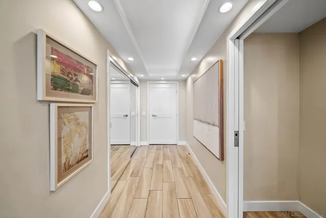 a bedroom with a bed and a night stand