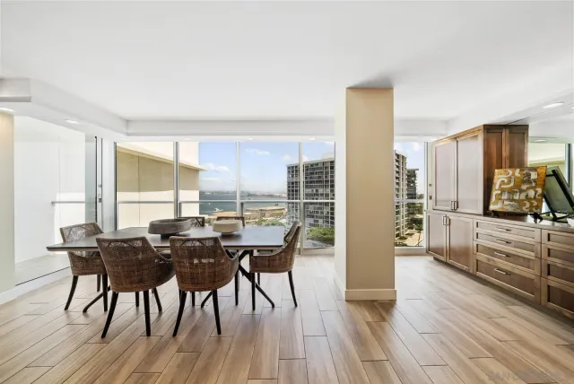 a view of a dining room with furniture and wooden floor
