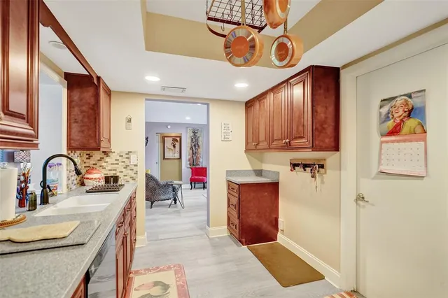 a kitchen with stainless steel appliances granite countertop a sink and cabinets
