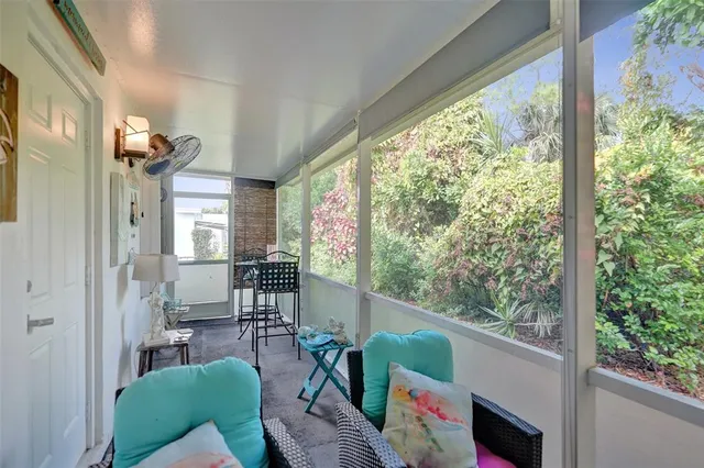 a living room filled with furniture and a window
