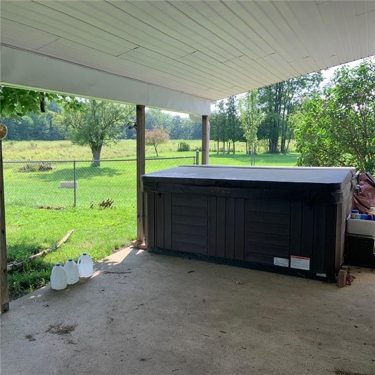 2201 Joiner Road Springboro, PA 16435 - Photo 15 of 25 a view of a backyard with a garden and trees