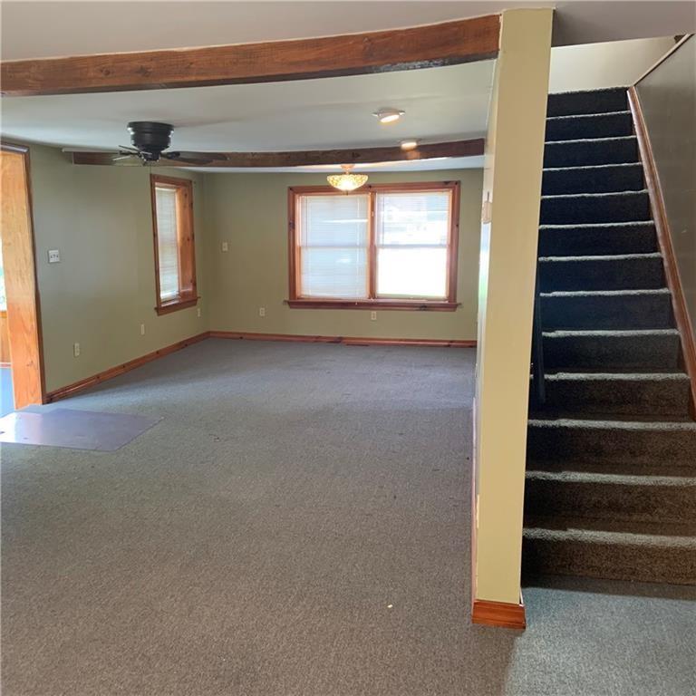 2201 Joiner Road Springboro, PA 16435 - Photo 7 of 25 a view of an empty room with stairs and a window