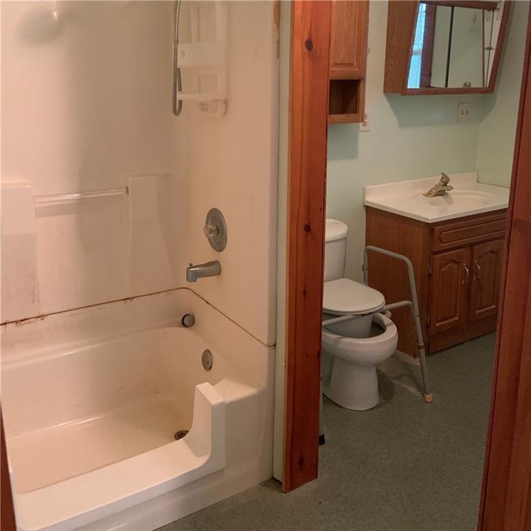 2201 Joiner Road Springboro, PA 16435 - Photo 9 of 25 a white bath tub sitting next to a white toilet