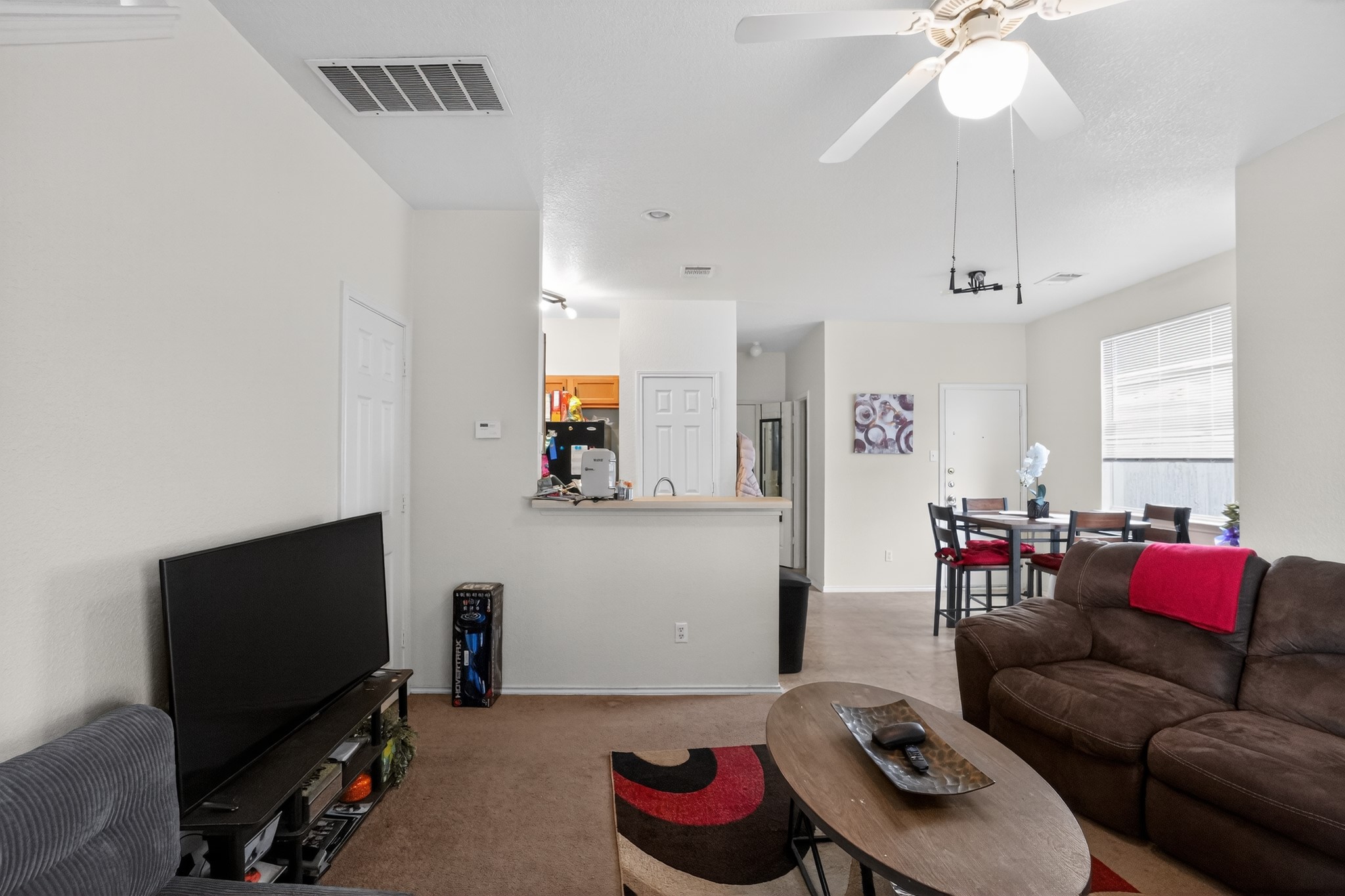 13808 Harris Ridge Boulevard Pflugerville, TX 78660 - Photo 40 of 40 a living room with furniture and a flat screen tv