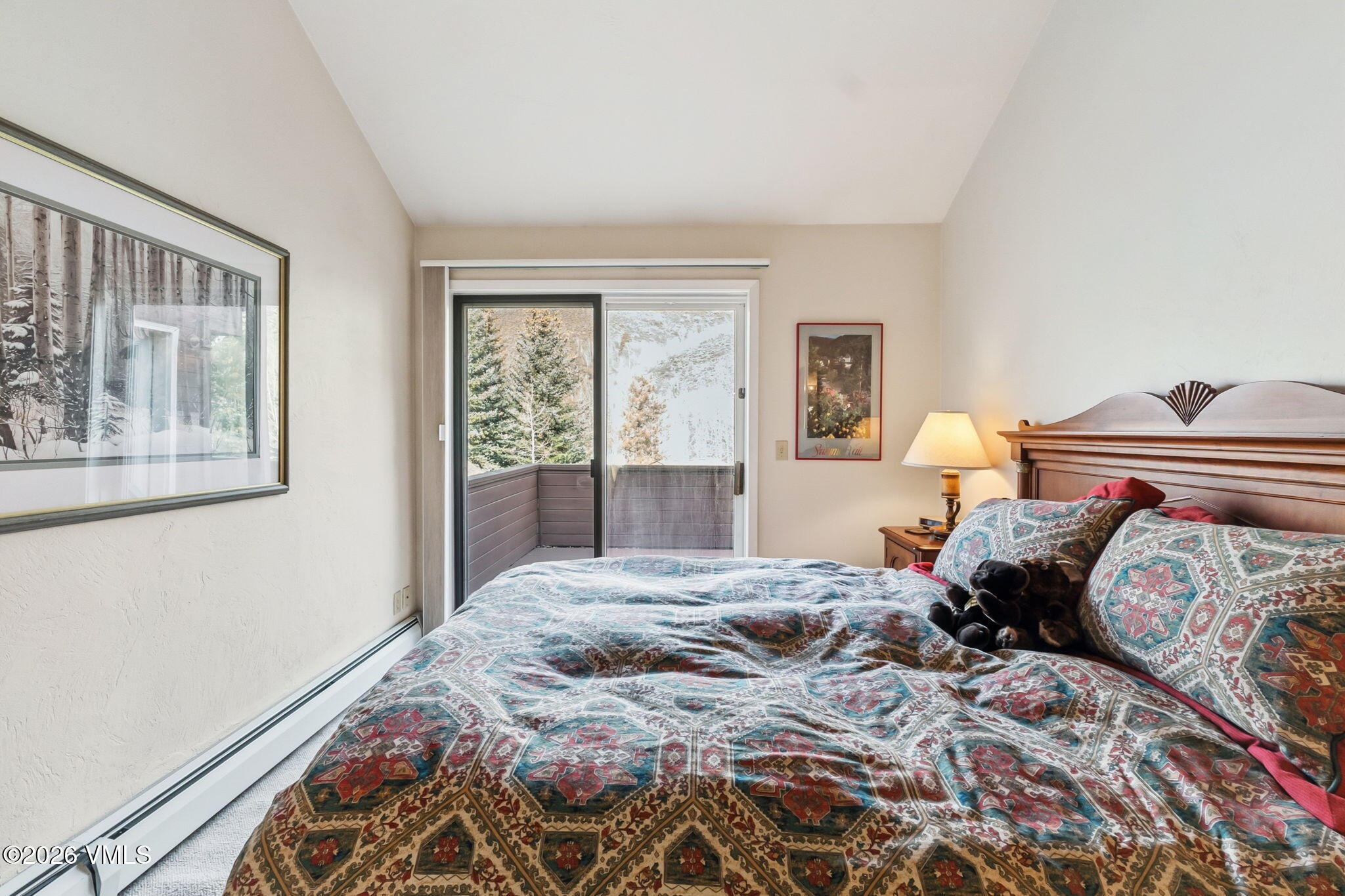1460 Ridge Lane, Unit D Vail, CO 81657 - Photo 9 of 18 a bedroom with a large bed and a window