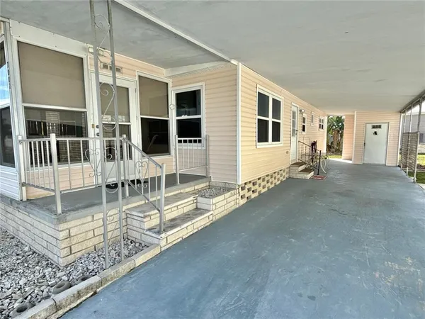 a view of a house with wooden floor and a view of house