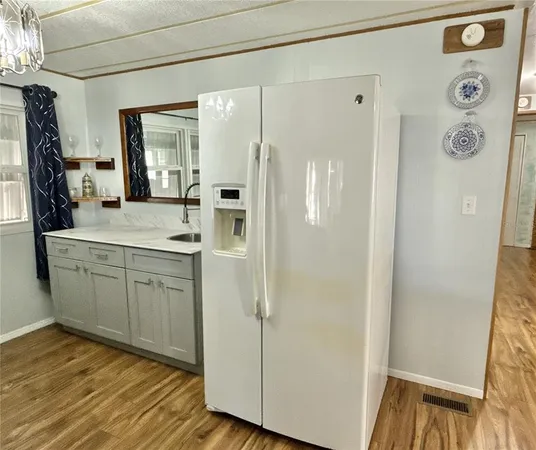 a bathroom with a shower sink and mirror
