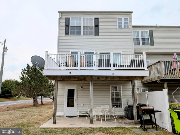 a front view of a house with barbeque oven