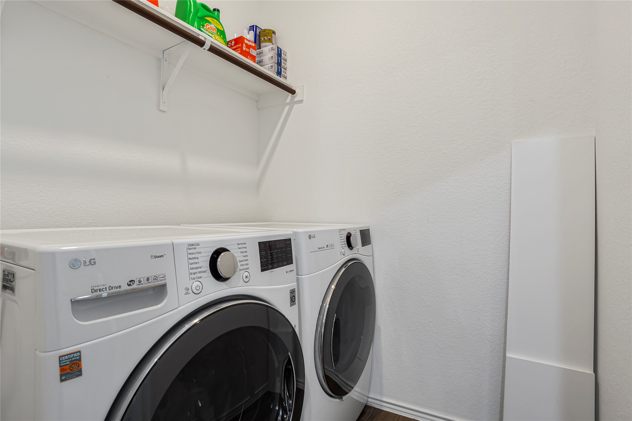 124 Cherry Ridge Road Georgetown, TX 78628 - Photo 19 of 23 Dedicated laundry area featuring a built-in wall shelf with hanging rod
