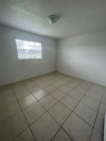 an empty room with a fireplace
