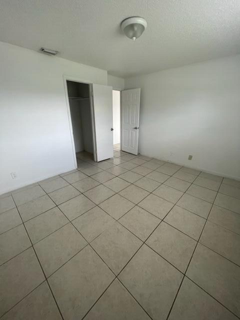4998 Kirk Road Lake Worth, FL 33461 - Photo 13 of 22 an empty room with a fireplace