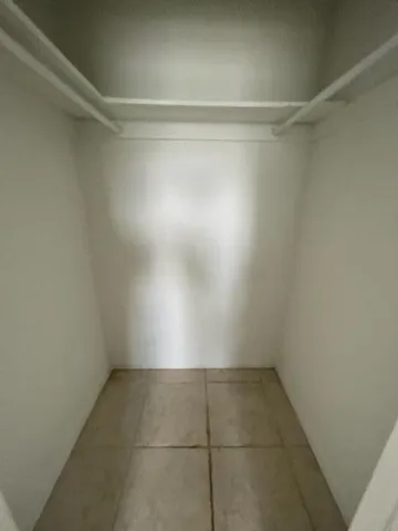 a bathroom with a toilet and a bathtub