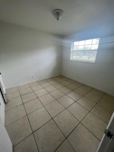 4998 Kirk Road Lake Worth, FL 33461 - Photo 16 of 22 an empty room with windows