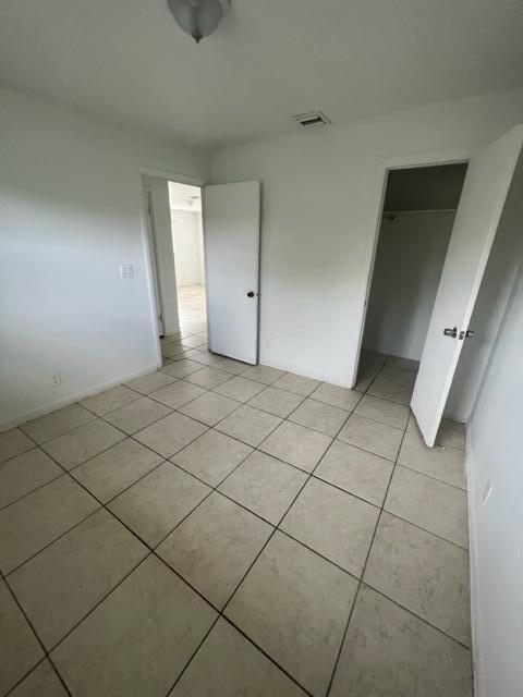 4998 Kirk Road Lake Worth, FL 33461 - Photo 17 of 22 a view of an empty room and wooden floor